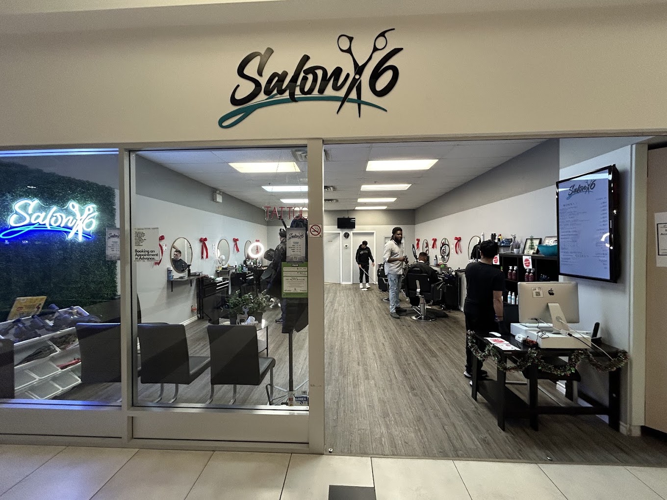 Salon 6 storefront inside Bowmanville Mall with the illuminated logo sign